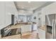 Bright kitchen featuring granite countertops, stainless steel appliances, and neutral cabinets at 1892 San Silvestro Dr, Venice, FL 34285