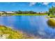 Picturesque lake view highlights the community's waterfront setting and beautiful natural surroundings at 1892 San Silvestro Dr, Venice, FL 34285