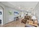 Spacious living room with an open floorplan, tile flooring, and bright interior; perfect for relaxing and entertaining at 1892 San Silvestro Dr, Venice, FL 34285