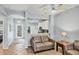Open concept living space showing tile flooring, leather furniture, and an adjacent kitchen at 1892 San Silvestro Dr, Venice, FL 34285