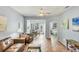 Bright living room features neutral paint, tile floors, and access to the breakfast nook at 1892 San Silvestro Dr, Venice, FL 34285