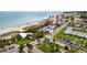 Scenic aerial view of beachside condos, green spaces, and the coastline at 19337 Cruise Dr, Venice, FL 34292