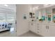 Modern bathroom with double vanity, white cabinets, and a separate toilet room off the bedroom at 19337 Cruise Dr, Venice, FL 34292