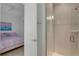 Bathroom with tile shower and view of bedroom at 19337 Cruise Dr, Venice, FL 34292