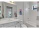 Clean and modern bathroom featuring a vanity, mirror, and a tub with shower at 19337 Cruise Dr, Venice, FL 34292