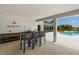 Outdoor community bar area with bar seating, sink, and countertop space, perfect for gatherings at 19337 Cruise Dr, Venice, FL 34292