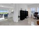 Open-concept living space with a modern kitchen and a comfortable office area at 19337 Cruise Dr, Venice, FL 34292