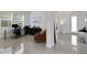 Multi-purpose room with a desk and chair. Large window letting in light at 19337 Cruise Dr, Venice, FL 34292