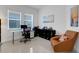 Comfortable home office featuring desk space, shelving, and natural light at 19337 Cruise Dr, Venice, FL 34292