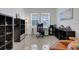 Well-lit home office with a workspace, shelving, and natural light at 19337 Cruise Dr, Venice, FL 34292