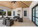 Community outdoor patio with fireplace, sofas, chairs, and tables for relaxing and socializing at 19337 Cruise Dr, Venice, FL 34292