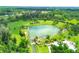 Beautiful aerial view of Warm Mineral Springs featuring lush green surroundings at 2032 Jagust Rd, North Port, FL 34288