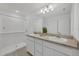 Bathroom features double sinks, a walk-in shower, and modern fixtures with ample lighting at 2032 Jagust Rd, North Port, FL 34288