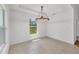 Bright dining area featuring modern chandelier, tile floors, and scenic views from the window at 2032 Jagust Rd, North Port, FL 34288