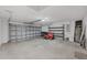 Spacious garage with ample storage and a well-maintained lawn mower at 2032 Jagust Rd, North Port, FL 34288