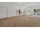 Bright living room flows into an open kitchen with a breakfast bar and access to the lanai at 2032 Jagust Rd, North Port, FL 34288