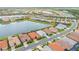 Aerial shot of an attractive community featuring homes encircling two lakes with lush green landscaping at 20660 Ovid Ln, Venice, FL 34293