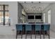 Stylish bar area with modern lighting, comfortable seating, and dual tv screens for residents' entertainment at 20660 Ovid Ln, Venice, FL 34293