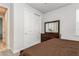 Bright bedroom showcasing a mirrored closet, matching dresser, and warm neutral colors at 20660 Ovid Ln, Venice, FL 34293