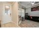 Fun bonus room with arcade games, a comfortable sofa, and stylish decor at 20660 Ovid Ln, Venice, FL 34293