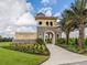 Elegant community entrance sign surrounded by lush landscaping and vibrant foliage at 20660 Ovid Ln, Venice, FL 34293