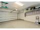 Spacious garage featuring an epoxy floor and ample storage, ideal for organization and convenience at 20660 Ovid Ln, Venice, FL 34293