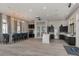 Community kitchen area with a large island, modern appliances, bar seating and contemporary lighting at 20660 Ovid Ln, Venice, FL 34293