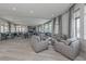 Expansive meeting room featuring tables, chairs, and inviting lounge areas with abundant natural light at 20660 Ovid Ln, Venice, FL 34293
