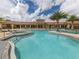Stunning community pool with ample seating and a hot tub, perfect for relaxation and socializing at 20660 Ovid Ln, Venice, FL 34293