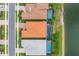Birds eye of multiple homes with private pools and screened lanais bordering a tranquil lake at 20660 Ovid Ln, Venice, FL 34293