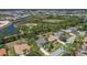 Expansive aerial view of the neighborhood featuring scenic water views and lush landscapes at 2092 Timucua Trl, Nokomis, FL 34275