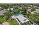 Aerial view of home featuring a pool, a well manicured yard, and mature landscaping at 2092 Timucua Trl, Nokomis, FL 34275
