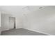 Large bedroom featuring neutral walls, gray tile floors, and ample open space for versatile furniture arrangements at 2092 Timucua Trl, Nokomis, FL 34275