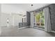 Well-lit dining area featuring modern decor, stylish wallpaper and large window at 2092 Timucua Trl, Nokomis, FL 34275