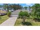 Charming single-story home featuring a well-maintained lawn, lush landscaping, and a two-car garage at 2092 Timucua Trl, Nokomis, FL 34275