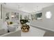 Bright living room boasts open concept layout, recessed lighting and a seamless flow into the kitchen at 2092 Timucua Trl, Nokomis, FL 34275