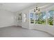 Living area boasts recessed lights, tiled flooring, neutral paint, built-in shelves, and a beautiful bay window at 2092 Timucua Trl, Nokomis, FL 34275
