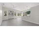 Bright and airy living room with sleek tiled floors and many windows providing lots of natural light at 2092 Timucua Trl, Nokomis, FL 34275
