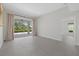Spacious living room with neutral decor, patio access and tile flooring at 2092 Timucua Trl, Nokomis, FL 34275