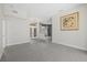 A brightly lit living room with white walls, tile floors and large windows provide great views at 2092 Timucua Trl, Nokomis, FL 34275