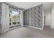 Living area featuring patterned wallpaper, large window with curtains and ample natural light at 2092 Timucua Trl, Nokomis, FL 34275