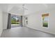 Airy main bedroom boasts tile flooring, recessed lighting and a sliding glass door to the patio at 2092 Timucua Trl, Nokomis, FL 34275