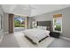 Spacious main bedroom features neutral tones, recessed lighting and a private outdoor patio at 2092 Timucua Trl, Nokomis, FL 34275