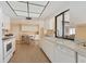 Functional kitchen with white cabinets, updated appliances, and an adjoining dining area for casual meals at 2311 Sandlewood Dr, Venice, FL 34293