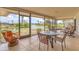 Screened lanai features outdoor seating overlooking the waterway with beautiful views at 2311 Sandlewood Dr, Venice, FL 34293