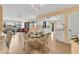 Cozy living area with an adjacent kitchen perfect for Gathering dinners and gatherings at 2311 Sandlewood Dr, Venice, FL 34293