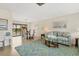 Bright living room with wood floors, a dining area, and a view of the water at 2311 Sandlewood Dr, Venice, FL 34293