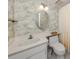 Bathroom with vanity, wallpaper, and classic fixtures at 232 Cerromar Way # 38, Venice, FL 34293