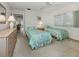 Bright bedroom featuring twin beds and a neutral color palette at 232 Cerromar Way # 38, Venice, FL 34293