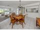 Open dining and living room area with tile floors and a view of the kitchen at 232 Cerromar Way # 38, Venice, FL 34293